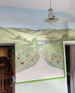A rolling cotswold scene with mill